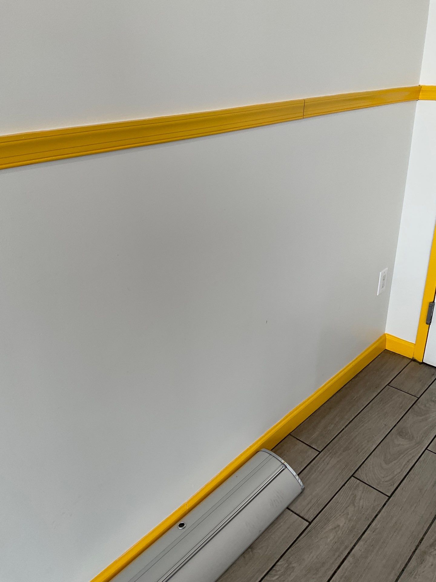 Bold Yellow Chair Rail Accent in a Commercial Space
