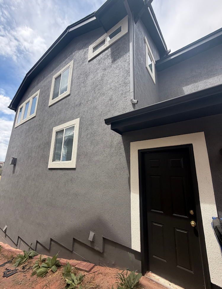 Grey Stucco Exterior with White Trim and Black Side Door /littleton, CO