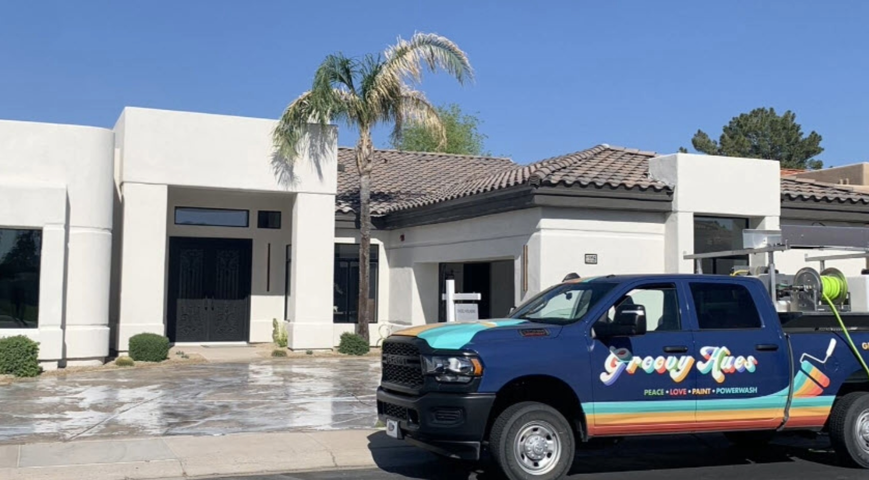 Freshly painted Orlando home with the Groovy Hues crew truck outside