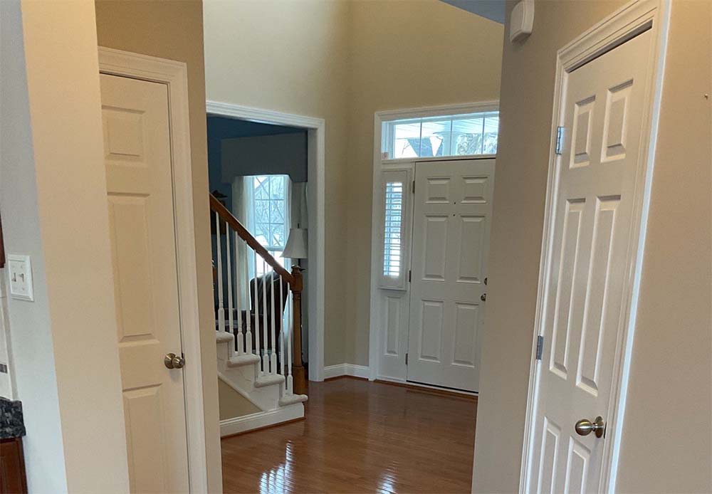 Entryway and staircase painted with neutral paint in Jamison PA home