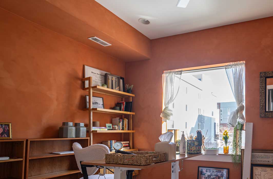 Interior limewash painting in a New Hope, PA home, featuring a warm terracotta limewash finish with soft texture and natural variation